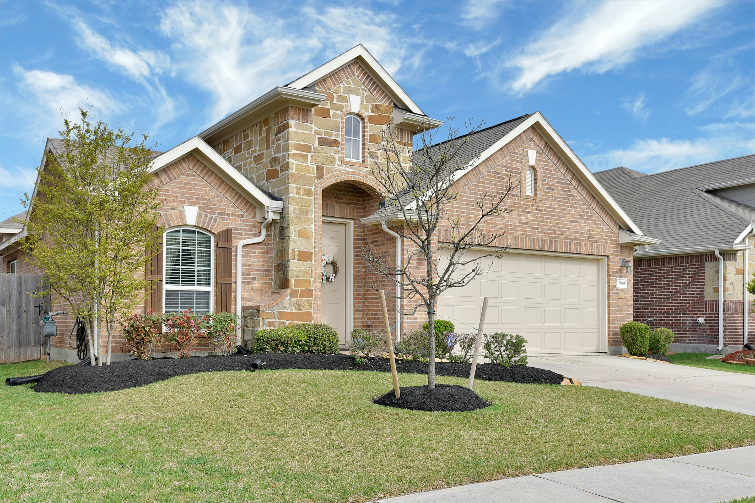 Brick home with landscaped front yard